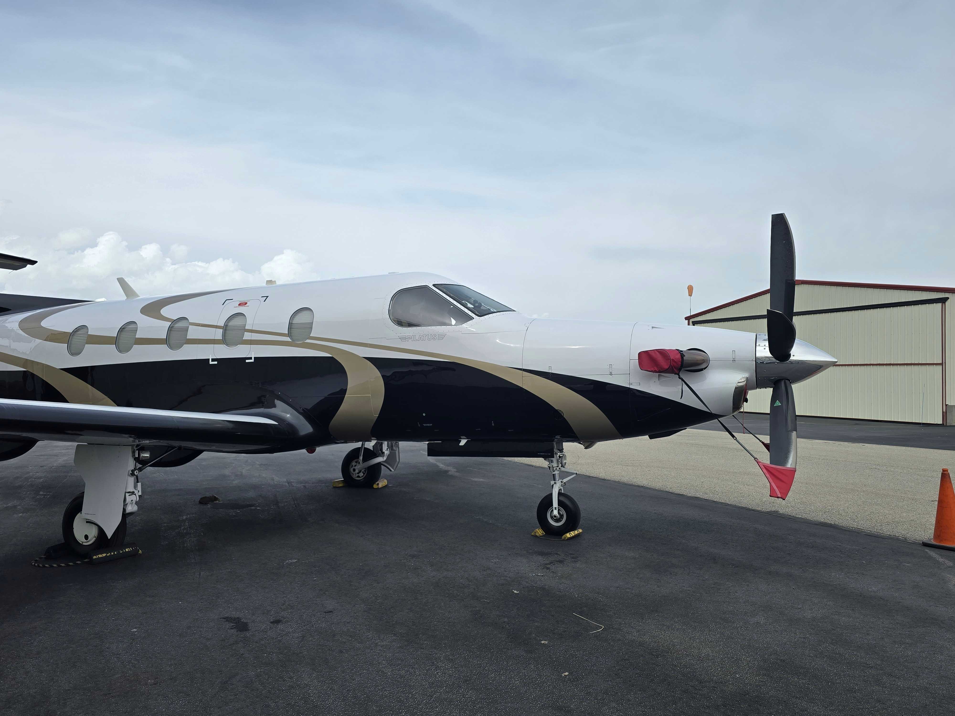 Pristine turboprop aircraft on Las Vegas tarmac ready for flight after professional detailing.