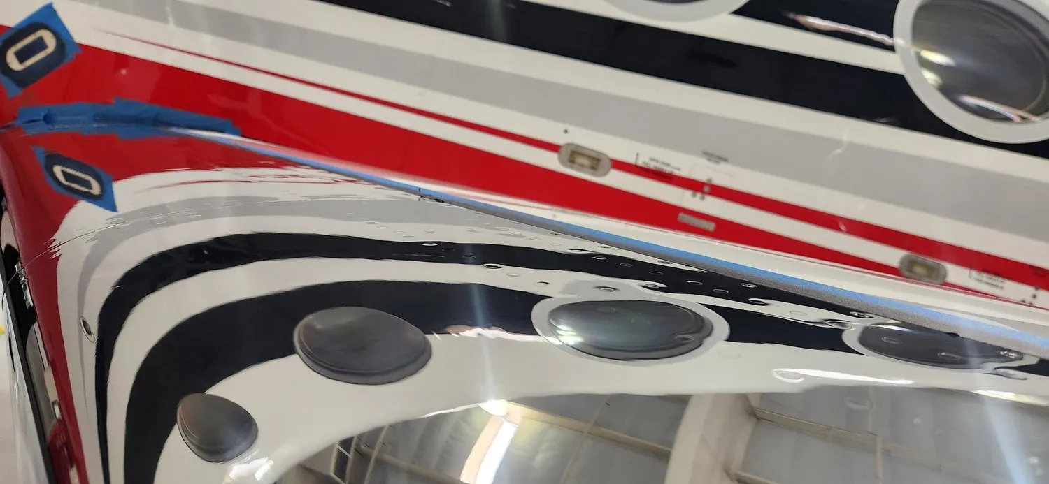 Close reflection detail on a freshly polished aircraft fuselage.