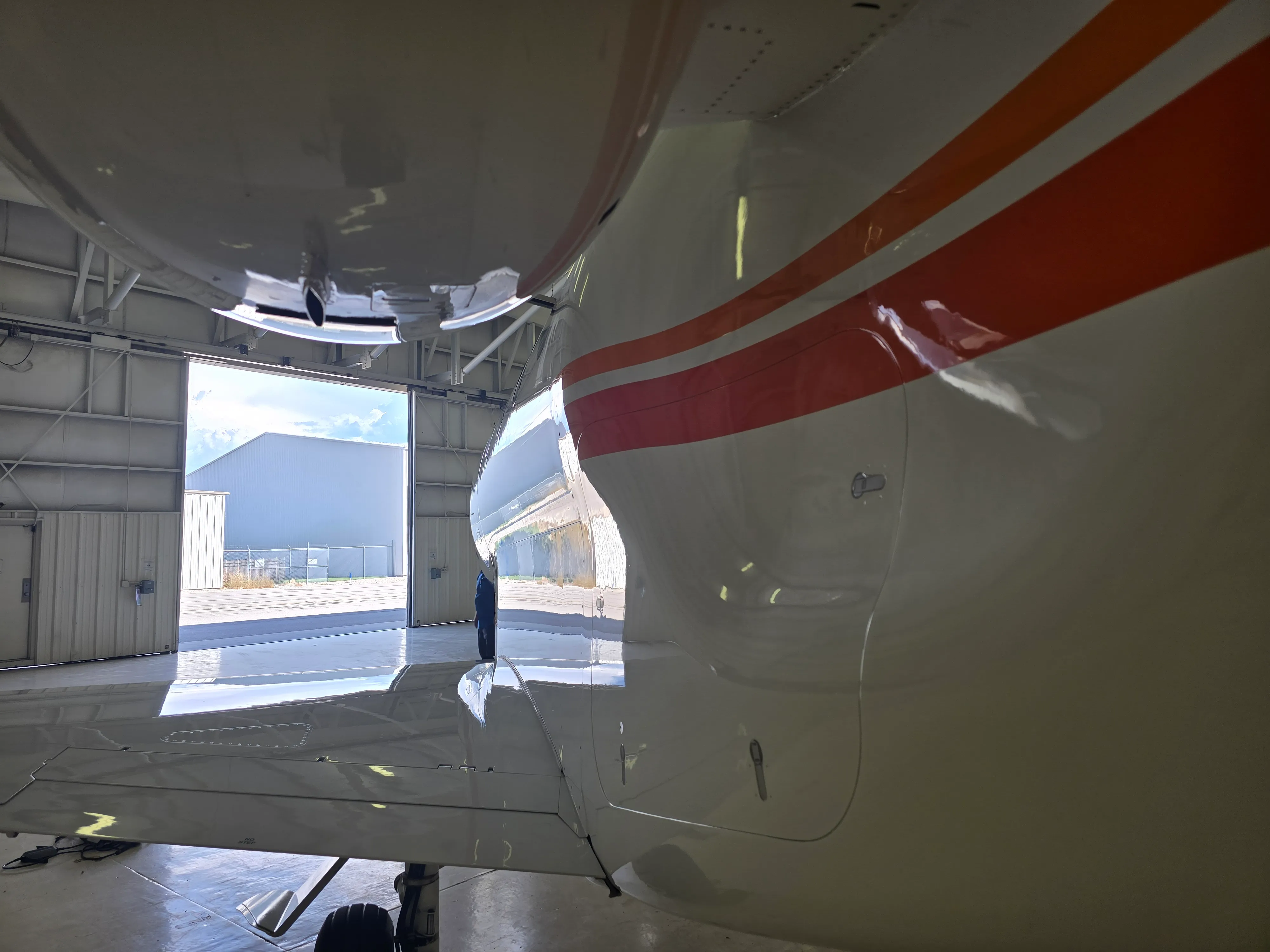 Professional aircraft detailing work in progress inside Las Vegas hangar.
